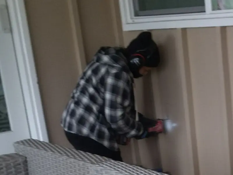 Professional electrician installing an exterior outlet in Limerick